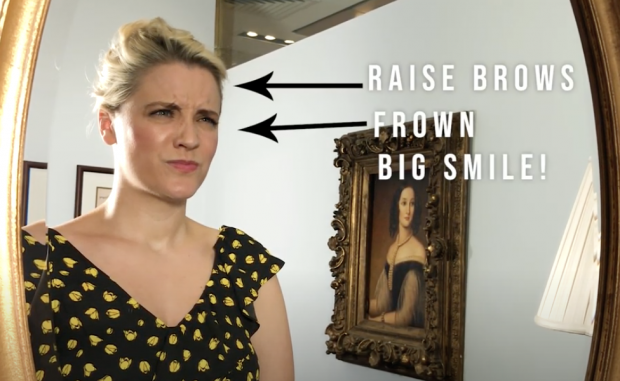 Raise bros and frown - big smile!