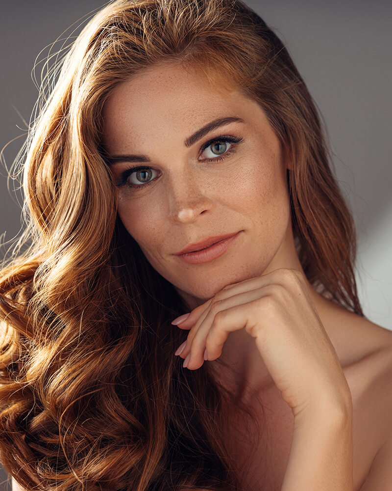 Mature woman with her hand on her chin