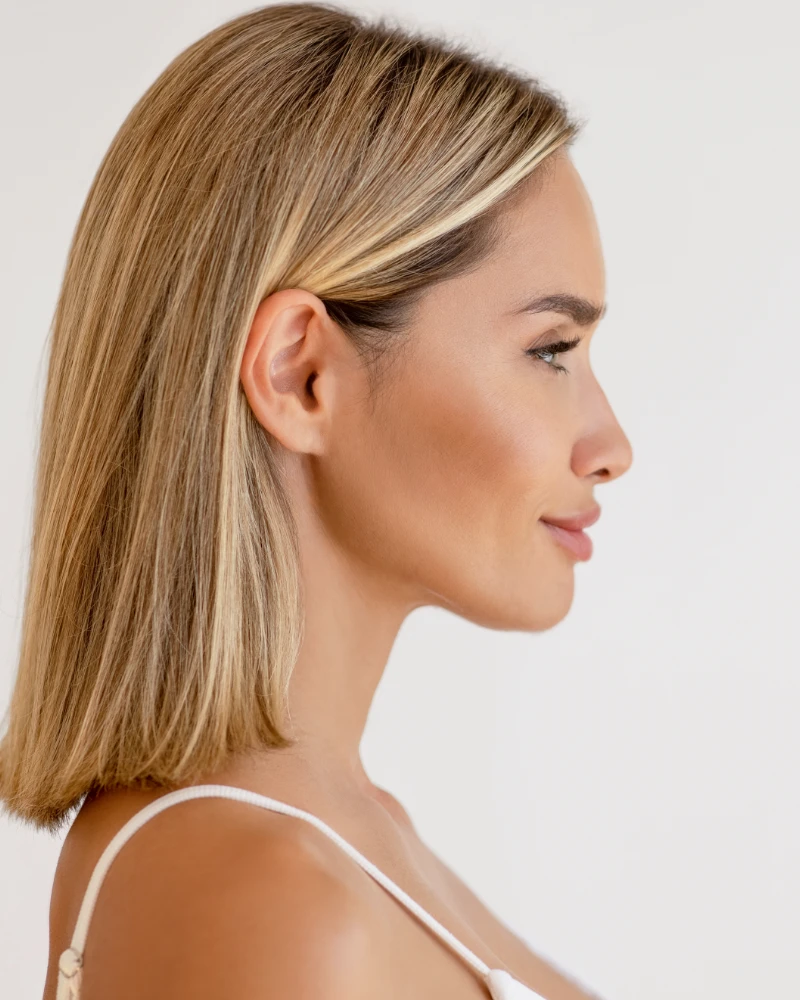 Profile of a woman with short blonde hair